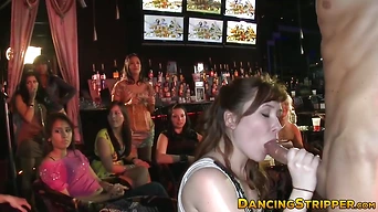 Amateur babes devouring big cock at a strip club