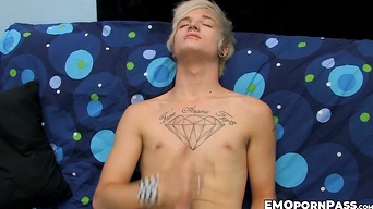 Blond Austin Mitchell jerks off massive cock before blowing off cum