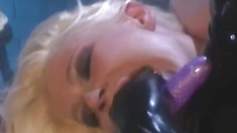 Vintage busty Victoria Sin fucking latex clad lesbian